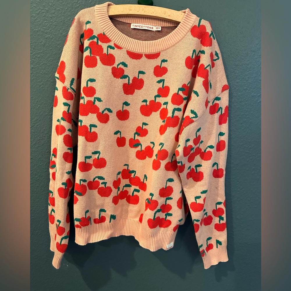 Cream and Red Cherry Sweater with Playful Design
